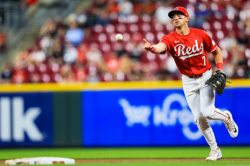 Apr 30, 2025; Cincinnati, Ohio, USA; Cincinnati Reds first baseman Spencer Steer (7) throws to first to get St. Louis Cardinals outfielder Alec Burleson (not pictured) out in the seventh inning at Great American Ball Park. Mandatory Credit: Katie Stratman-Imagn Images