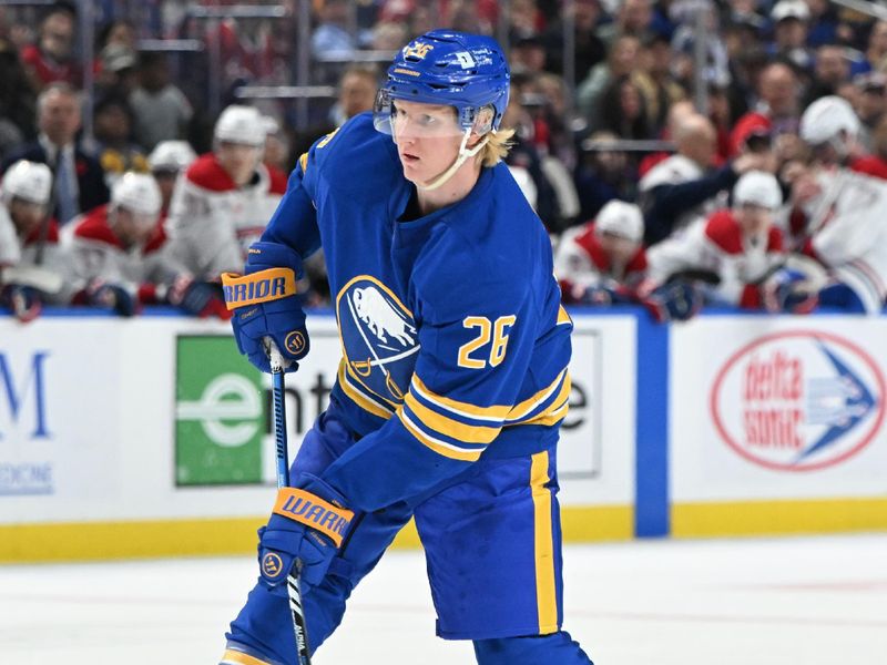 Nov 11, 2024; Buffalo, New York, USA; Buffalo Sabres defenseman Rasmus Dahlin (26) looks to pass the puck in the second period against the Montreal Canadiens at KeyBank Center. Mandatory Credit: Mark Konezny-Imagn Images