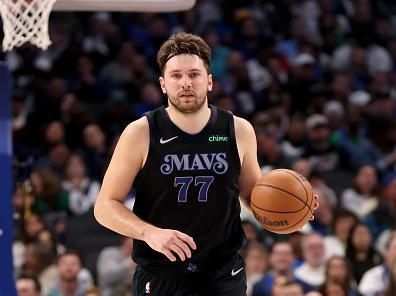 DALLAS, TEXAS - DECEMBER 20: Luka Doncic #77 of the Dallas Mavericks dribbles the ball up court against the LA Clippers in the first half at American Airlines Center on December 20, 2023 in Dallas, Texas. NOTE TO USER: User expressly acknowledges and agrees that, by downloading and or using this photograph, User is consenting to the terms and conditions of the Getty Images License Agreement. (Photo by Tim Heitman/Getty Images)