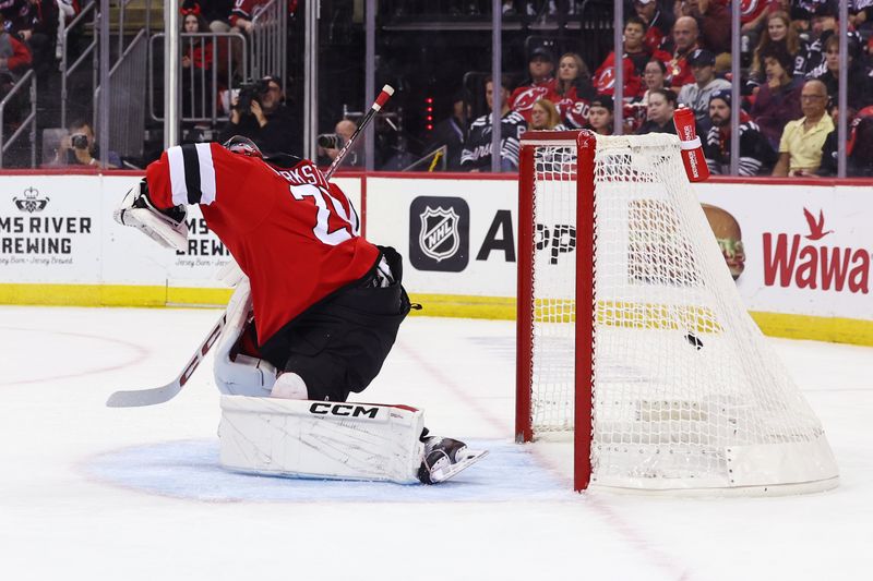 Oct 10, 2024; Newark, New Jersey, USA; Toronto Maple Leafs center Steven Lorentz (18) (not shown) scores a goal on New Jersey Devils goaltender Jacob Markstrom (25) during the first period at Prudential Center. Mandatory Credit: Ed Mulholland-Imagn Images