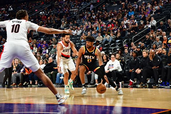 PHOENIX, AZ - JANUARY  1: Jordan Goodwin #0 of the Phoenix Suns handles the ball during the game against the Portland Trail Blazers on January 1, 2024 at Footprint Center in Phoenix, Arizona. NOTE TO USER: User expressly acknowledges and agrees that, by downloading and or using this photograph, user is consenting to the terms and conditions of the Getty Images License Agreement. Mandatory Copyright Notice: Copyright 2024 NBAE (Photo by Kate Frese/NBAE via Getty Images)