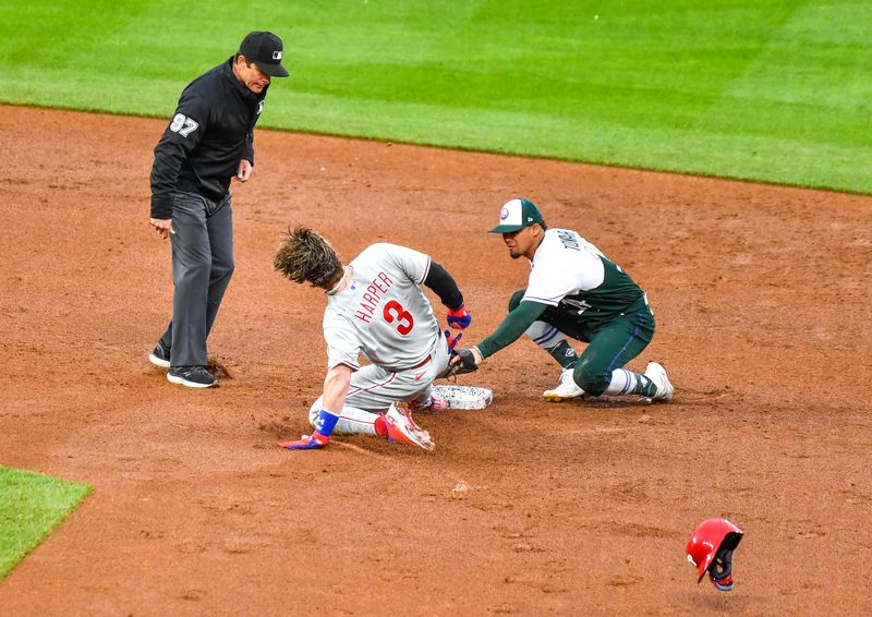 May 13, 2023; Denver, Colorado, USA;  Philadelphia Phillies designated hitter Bryce Harper (3) slides in at second base under the tag from Colorado Rockies shortstop Ezequiel Tovar (14) for a double in the second inning at Coors Field. Mandatory Credit: John Leyba-USA TODAY Sports