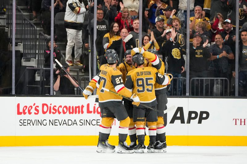 Oct 9, 2024; Las Vegas, Nevada, USA; Vegas Golden Knights celebrates after scoring a goal against the Colorado Avalanche during the third period at T-Mobile Arena. Mandatory Credit: Lucas Peltier-Imagn Images