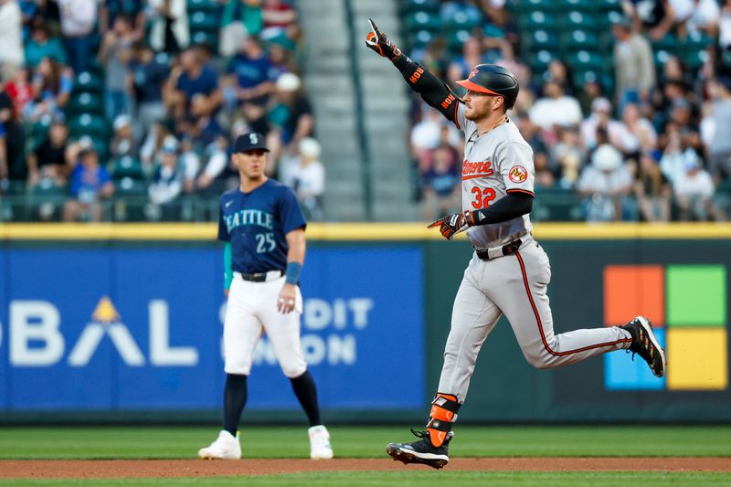 Jul 3, 2024; Seattle, Washington, USA; Baltimore Orioles first baseman Ryan O'Hearn (32) reacts towards the Orioles bullpen after hitting a solo-home run against the Seattle Mariners during the fifth inning at T-Mobile Park. Mandatory Credit: Joe Nicholson-USA TODAY Sports