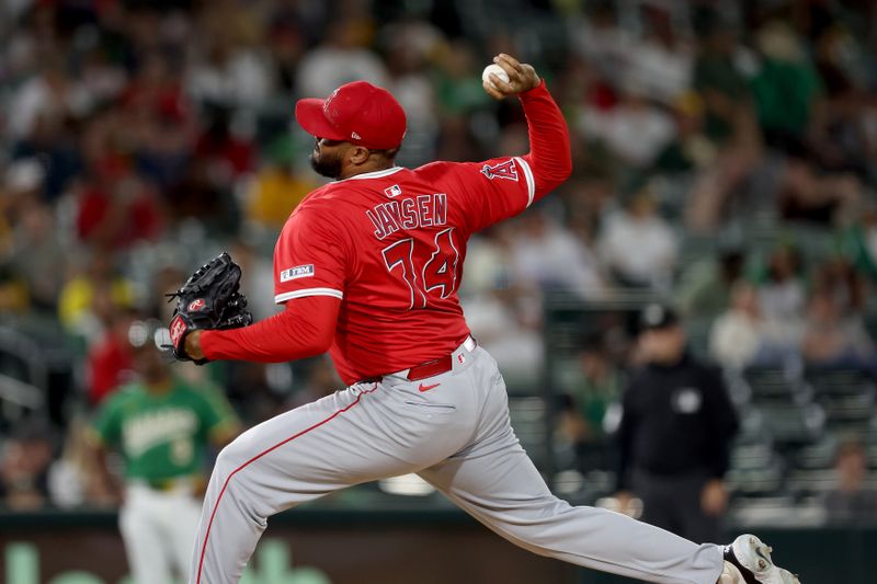 May 19, 2025; West Sacramento, California, USA; Los Angeles Angels pitcher Kenley Jansen (74) delivers a pitch against the Athletics during the ninth inning at Sutter Health Park. Mandatory Credit: Dennis Lee-Imagn Images