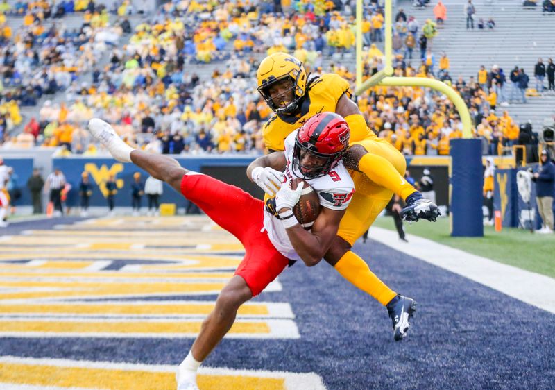 Sep 23, 2023; Morgantown, West Virginia, USA; Texas Tech Red Raiders wide receiver Jerand Bradley (9) catches a pass for a touchdown against West Virginia Mountaineers cornerback Malachi Ruffin (14) during the fourth quarter at Mountaineer Field at Milan Puskar Stadium. Mandatory Credit: Ben Queen-USA TODAY Sports