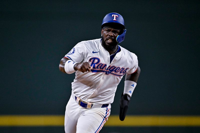 Aug 15, 2024; Arlington, Texas, USA; Texas Rangers right fielder Adolis Garcia (53) runs tp third base during the third inning against the Minnesota Twins at Globe Life Field. Mandatory Credit: Jerome Miron-USA TODAY Sports