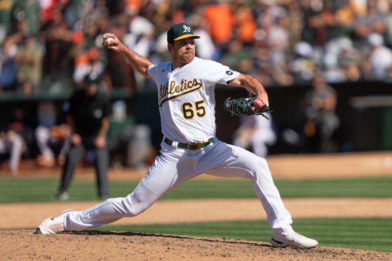 Aug 6, 2023; Oakland, California, USA;  Oakland Athletics relief pitcher Trevor May (65) pitches during the ninth inning against the San Francisco Giants at Oakland-Alameda County Coliseum. Mandatory Credit: Stan Szeto-USA TODAY Sports