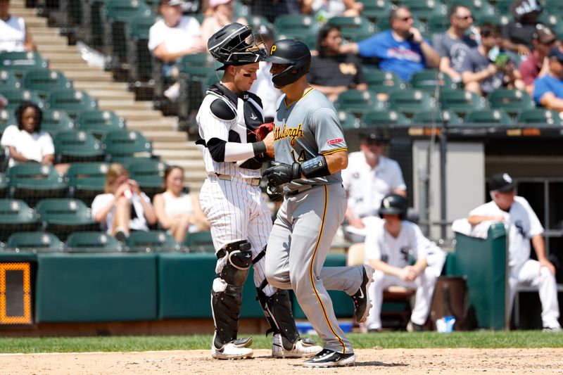Jul 14, 2024; Chicago, Illinois, USA; Pittsburgh Pirates catcher Joey Bart (14) crosses home plate after hitting a three-run home run against the Chicago White Sox during the fourth inning at Guaranteed Rate Field. Mandatory Credit: Kamil Krzaczynski-USA TODAY Sports