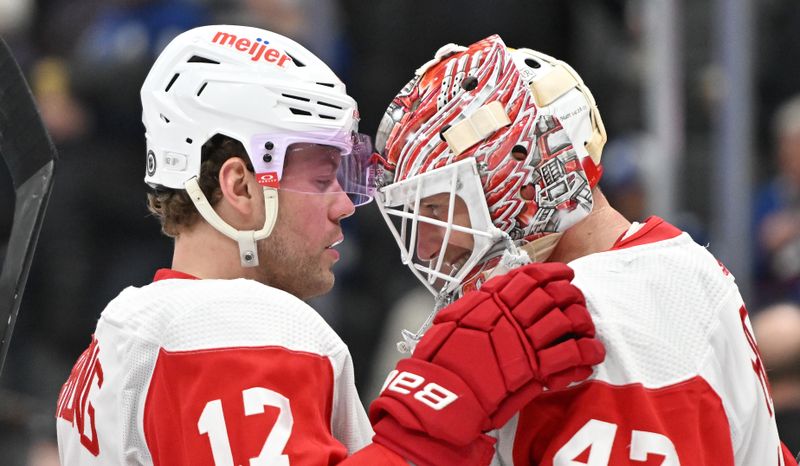 Jan 14, 2024; Toronto, Ontario, CAN;  Detroit Red Wings goalie James Reimer (47) and forward Daniel Sprong (17) celebrate after a win over the Toronto Maple Leafs at Scotiabank Arena. Mandatory Credit: Dan Hamilton-USA TODAY Sports