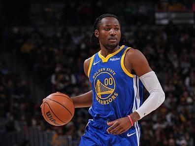 DENVER, CO - DECEMBER 25: Jonathan Kuminga #00 of the Golden State Warriors looks on during the game against the Denver Nuggets on December 25, 2023 at the Ball Arena in Denver, Colorado. NOTE TO USER: User expressly acknowledges and agrees that, by downloading and/or using this Photograph, user is consenting to the terms and conditions of the Getty Images License Agreement. Mandatory Copyright Notice: Copyright 2023 NBAE (Photo by Bart Young/NBAE via Getty Images)