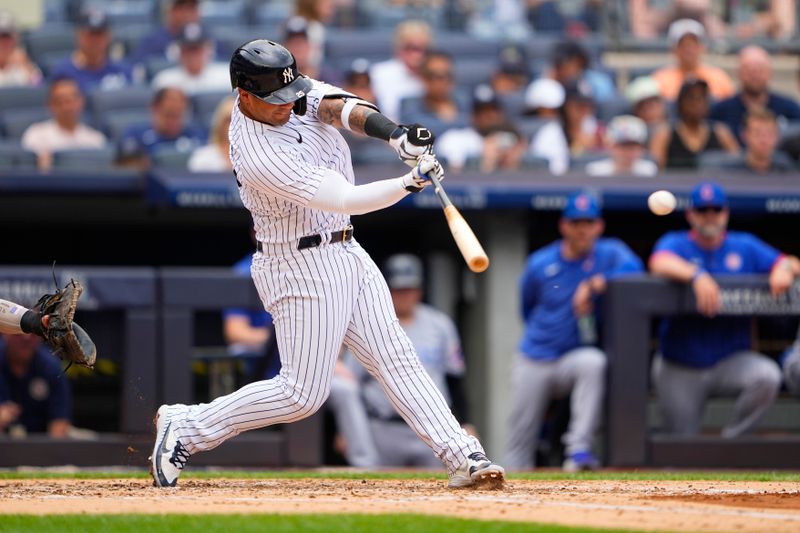 Jul 8, 2023; Bronx, New York, USA; New York Yankees second baseman Gleybor Torres (25) hits a single against the Chicago Cubs during the third inning at Yankee Stadium. Mandatory Credit: Gregory Fisher-USA TODAY Sports