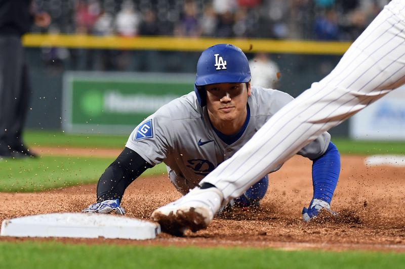 Jun 25, 2025; Denver, Colorado, USA; Los Angeles Dodgers two-way player Shohei Ohtani (17) is forced out at first base after a line drive out by first base Freddie Freeman (not pictured) during the ninth inning against the Colorado Rockies at Coors Field. Mandatory Credit: Christopher Hanewinckel-Imagn Images