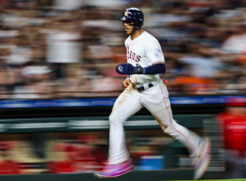 Sep 21, 2024; Houston, Texas, USA; Houston Astros shortstop Jeremy Pena (3) scores from third base against the Los Angeles Angels in the fourth inning at Minute Maid Park. Mandatory Credit: Thomas Shea-Imagn Images