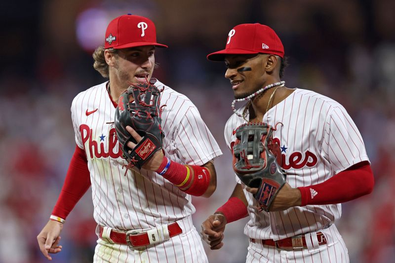 Oct 3, 2023; Philadelphia, Pennsylvania, USA; Philadelphia Phillies second baseman Bryson Stott (5) and center fielder Johan Rojas (18) react after the second inning during game one of the Wildcard series for the 2023 MLB playoffs at Citizens Bank Park. Mandatory Credit: Bill Streicher-USA TODAY Sports