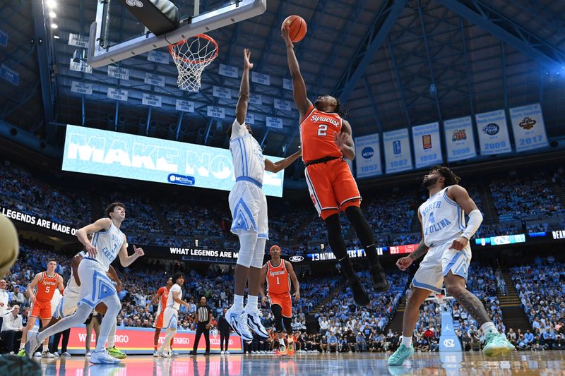 Jan 13, 2024; Chapel Hill, North Carolina, USA;  Syracuse Orange guard JJ Starling (2) shoots as North Carolina Tar Heels forward Jalen Washington (13) defends in the first half at Dean E. Smith Center. Mandatory Credit: Bob Donnan-USA TODAY Sports