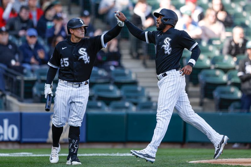 Apr 18, 2023; Chicago, Illinois, USA; Chicago White Sox second baseman Elvis Andrus (1) celebrates with first baseman Andrew Vaughn (25) after scoring against the Philadelphia Phillies during the third inning of game one of the doubleheader at Guaranteed Rate Field. Mandatory Credit: Kamil Krzaczynski-USA TODAY Sports