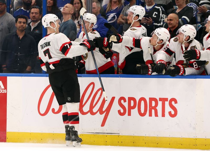 Apr 11, 2024; Tampa, Florida, USA; Ottawa Senators left wing Brady Tkachuk (7) is congratulated after he scores a goal against the Tampa Bay Lightning during a shoot out at Amalie Arena. Mandatory Credit: Kim Klement Neitzel-USA TODAY Sports