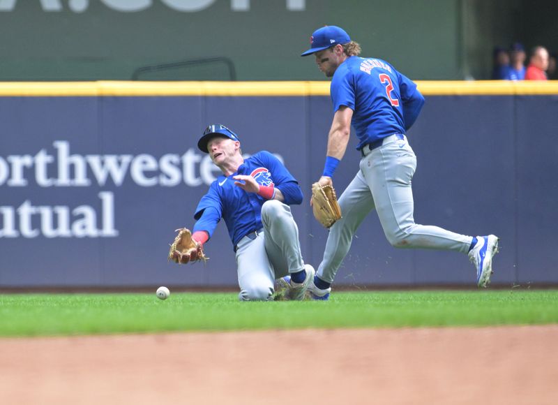 Jun 29, 2024; Milwaukee, Wisconsin, USA; Chicago Cubs outfielder Pete Crow-Armstrong (52) and Chicago Cubs second base Nico Hoerner (2) can’t field a fly ball against the Milwaukee Brewers in the third inning at American Family Field. Mandatory Credit: Michael McLoone-USA TODAY Sports