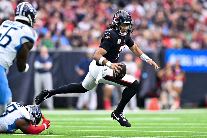 Houston Texans quarterback C.J. Stroud (7) runs the ball during the fourth quarter against the Tennessee Titans during an NFL football game, Sunday, Nov 24, 2024 in Houston. The Titans defeated the Texans 32-27. (AP Photo/Maria Lysaker)