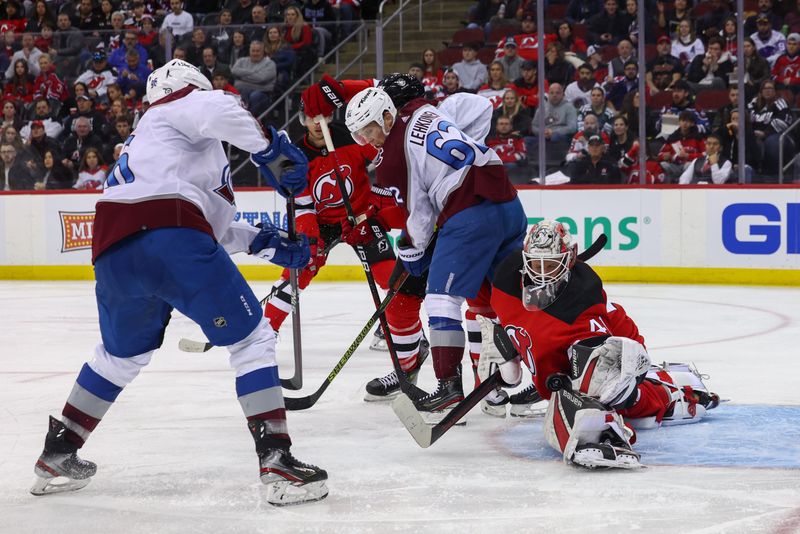 Feb 6, 2024; Newark, New Jersey, USA; New Jersey Devils goaltender Vitek Vanecek (41) makes a save on Colorado Avalanche center Ross Colton (20) during the third period at Prudential Center. Mandatory Credit: Ed Mulholland-USA TODAY Sports