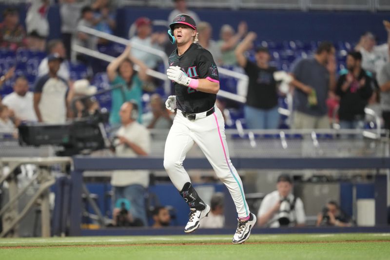 May 3, 2025; Miami, Florida, USA;  Miami Marlins right fielder Kyle Stowers (28) rounds third base after hitting a two-run home run in the third inning against the Oakland Athletics at loanDepot Park. Mandatory Credit: Jim Rassol-Imagn Images