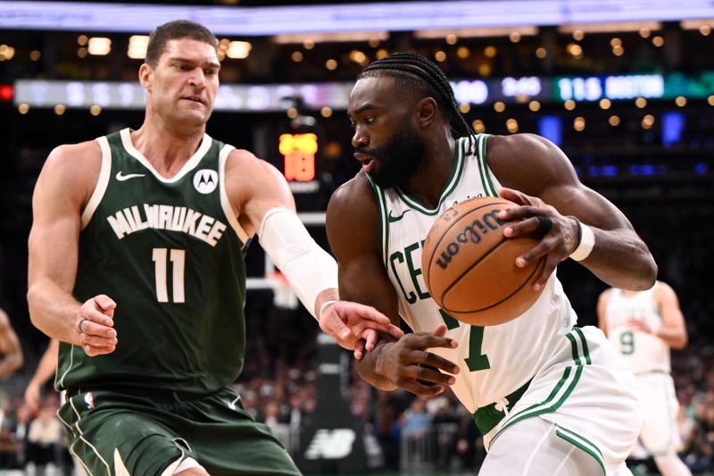 BOSTON, MASSACHUSETTS - OCTOBER 28: Jaylen Brown #7 of the Boston Celtics drives to the basket against Brook Lopez #11 of the Milwaukee Bucks during the second half at the TD Garden on October 28, 2024 in Boston, Massachusetts. NOTE TO USER: User expressly acknowledges and agrees that, by downloading and or using this photograph, User is consenting to the terms and conditions of the Getty Images License Agreement. (Photo by Brian Fluharty/Getty Images)