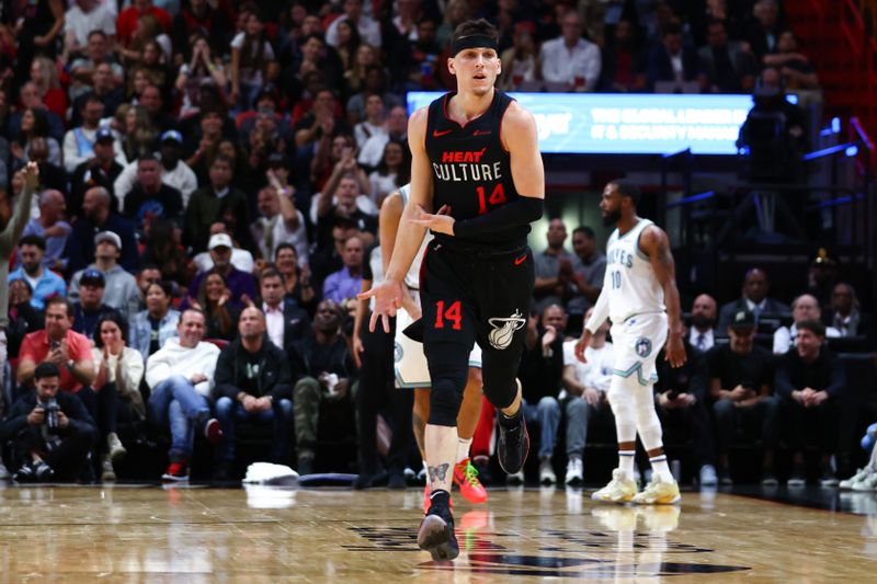 MIAMI, FLORIDA - DECEMBER 18: Tyler Herro #14 of the Miami Heat reacts after making a basket against the Minnesota Timberwolves at Kaseya Center on December 18, 2023 in Miami, Florida. NOTE TO USER: User expressly acknowledges and agrees that, by downloading and or using this photograph, User is consenting to the terms and conditions of the Getty Images License Agreement. (Photo by Megan Briggs/Getty Images)