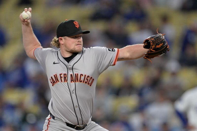 Apr 2, 2024; Los Angeles, California, USA;  San Francisco Giants starting pitcher Logan Webb (62) delivers in the first inning against the Los Angeles Dodgers at Dodger Stadium. Mandatory Credit: Jayne Kamin-Oncea-USA TODAY Sports