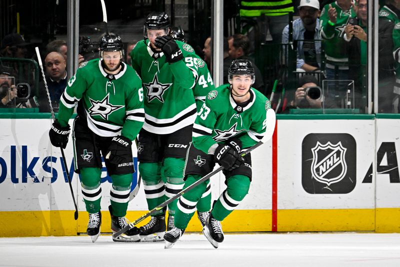 May 15, 2023; Dallas, Texas, USA; Dallas Stars center Wyatt Johnston (53) and left wing Jamie Benn (14) and defenseman Thomas Harley (55) and defenseman Joel Hanley (44) celebrate after Johnston scores the game winning goal against the Seattle Kraken during the third period in game seven of the second round of the 2023 Stanley Cup Playoffs at the American Airlines Center. Mandatory Credit: Jerome Miron-USA TODAY Sports