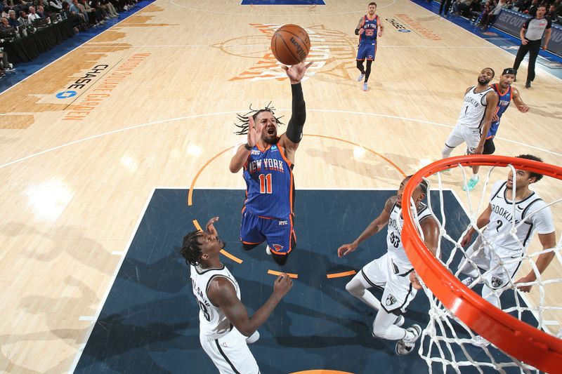 NEW YORK, NY - MARCH 23: Jalen Brunson #11 of the New York Knicks shoots the ball during the game against the Brooklyn Nets on March 23, 2024 at Madison Square Garden in New York City, New York.  NOTE TO USER: User expressly acknowledges and agrees that, by downloading and or using this photograph, User is consenting to the terms and conditions of the Getty Images License Agreement. Mandatory Copyright Notice: Copyright 2024 NBAE  (Photo by Nathaniel S. Butler/NBAE via Getty Images)