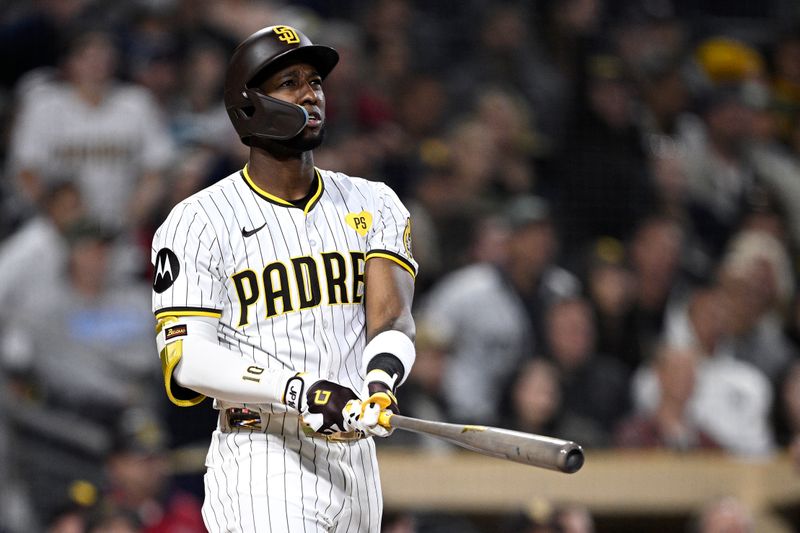 May 13, 2024; San Diego, California, USA; San Diego Padres left fielder Jurickson Profar (10) hits a two-run home run against the Colorado Rockies during the sixth inning at Petco Park. Mandatory Credit: Orlando Ramirez-USA TODAY Sports