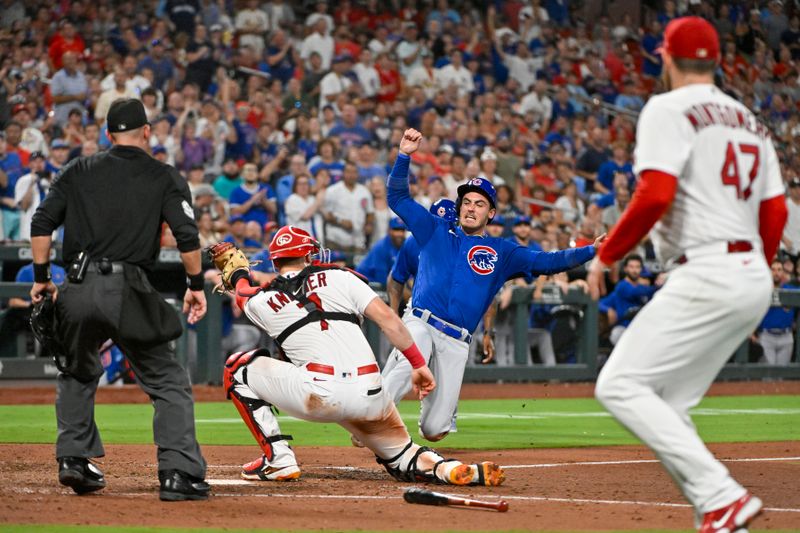 Jul 28, 2023; St. Louis, Missouri, USA;  Chicago Cubs center fielder Cody Bellinger (24) is tagged out at home plate by St. Louis Cardinals catcher Andrew Knizner (7) during the sixth inning at Busch Stadium. Mandatory Credit: Jeff Curry-USA TODAY Sports