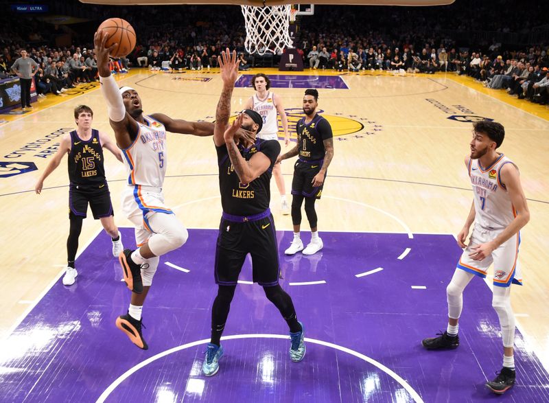 LOS ANGELES, CA - JANUARY 15: Luguentz Dort #5 of the Oklahoma City Thunder drives to the basket during the game against the Los Angeles Lakers on January 15, 2024 at Crypto.Com Arena in Los Angeles, California. NOTE TO USER: User expressly acknowledges and agrees that, by downloading and/or using this Photograph, user is consenting to the terms and conditions of the Getty Images License Agreement. Mandatory Copyright Notice: Copyright 2024 NBAE (Photo by Juan Ocampo/NBAE via Getty Images)