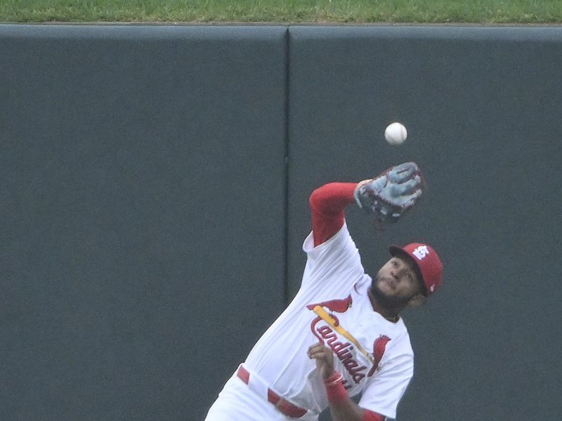 Apr 10, 2024; St. Louis, Missouri, USA; St. Louis Cardinals center fielder Victor Scott II (11) makes an error on a fly ball by Philadelphia Phillies catcher J.T. Realmuto (not pictured) during the first inning at Busch Stadium. Mandatory Credit: Jeff Curry-USA TODAY Sports