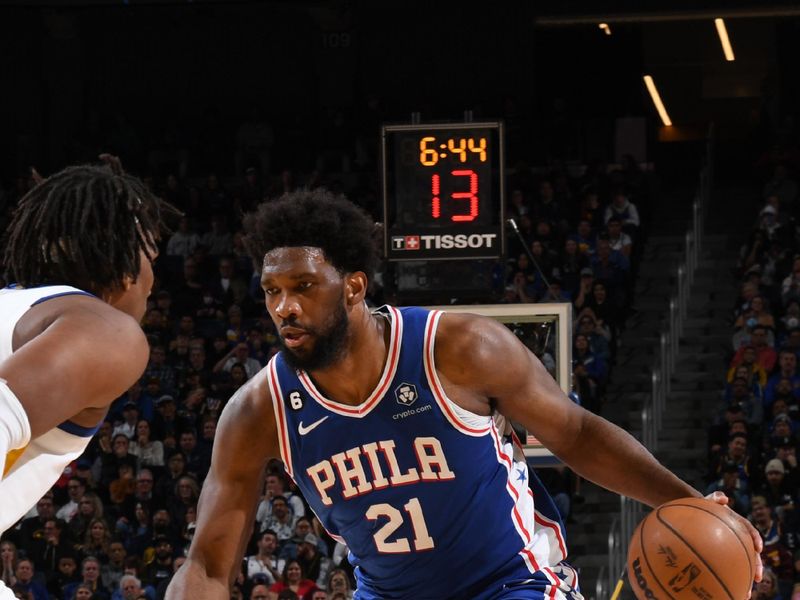 SAN FRANCISCO, CA - MARCH 24: Joel Embiid #21 of the Philadelphia 76ers dribbles the ball during the game against the Golden State Warriors on March 24, 2023 at Chase Center in San Francisco, California. NOTE TO USER: User expressly acknowledges and agrees that, by downloading and or using this photograph, user is consenting to the terms and conditions of Getty Images License Agreement. Mandatory Copyright Notice: Copyright 2023 NBAE (Photo by Noah Graham/NBAE via Getty Images)