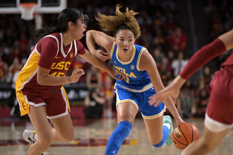 Jan 14, 2024; Los Angeles, California, USA; USC Trojans guard Kayla Padilla (45) defends UCLA Bruins guard Kiki Rice (1) in the first half at Galen Center. Mandatory Credit: Jayne Kamin-Oncea-USA TODAY Sports