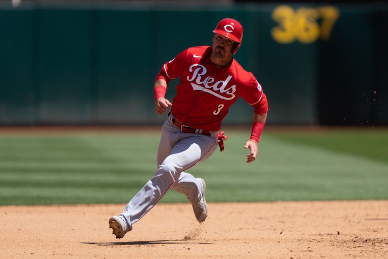 Apr 30, 2023; Oakland, California, USA;  Cincinnati Reds second baseman Matt Reynolds (3) runs towards third base during the fifth inning against the Oakland Athletics at RingCentral Coliseum. Mandatory Credit: Stan Szeto-USA TODAY Sports