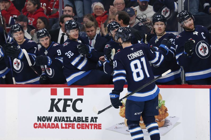 Dec 14, 2024; Winnipeg, Manitoba, CAN; Winnipeg Jets left wing Kyle Connor (81) celebrates his second period goal against the Montreal Canadiens at Canada Life Centre. Mandatory Credit: James Carey Lauder-Imagn Images