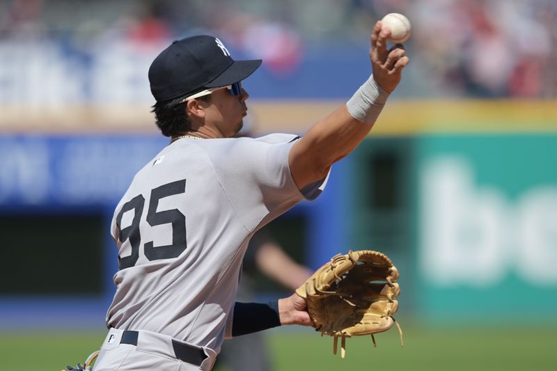 Apr 23, 2025; Cleveland, Ohio, USA; New York Yankees third baseman Oswaldo Cabrera (95) throws out Cleveland Guardians first baseman Carlos Santana (not pictured) during the sixth inning at Progressive Field. Mandatory Credit: Ken Blaze-Imagn Images