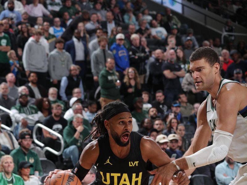 MILWAUKEE, WI - NOVEMBER 7: Patty Mills #8 of the Utah Jazz drives to the basket during the game against the Milwaukee Bucks on November 7, 2024 at Fiserv Forum Center in Milwaukee, Wisconsin. NOTE TO USER: User expressly acknowledges and agrees that, by downloading and or using this Photograph, user is consenting to the terms and conditions of the Getty Images License Agreement. Mandatory Copyright Notice: Copyright 2024 NBAE (Photo by Gary Dineen/NBAE via Getty Images).