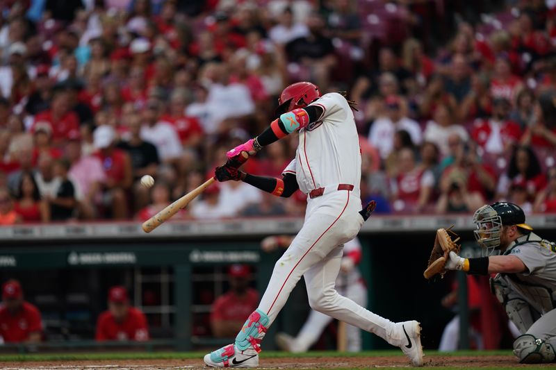 Aug 29, 2024; Cincinnati, Ohio, USA;  Cincinnati Reds shortstop Elly De La Cruz (44) hits the ball during the seventh inning of the MLB game between the Cincinnati Reds and Oakland Athletics, Thursday, Aug. 29, 2024, at Cintas Center in Cincinnati. The Reds won 10-9. Mandatory Credit: Frank Bowen IV/The Cincinnati Enquirer-USA TODAY Sports