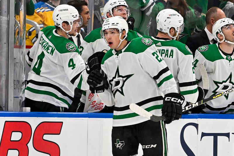 Dec 27, 2023; St. Louis, Missouri, USA;  Dallas Stars left wing Jason Robertson (21) is congratulated by defenseman Miro Heiskanen (4) after scoring against the St. Louis Blues during the second period at Enterprise Center. Mandatory Credit: Jeff Curry-USA TODAY Sports