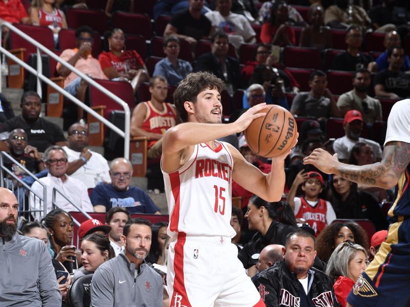 HOUSTON, TX - OCTOBER 15: Reed Sheppard #15 of the Houston Rockets handles the ball during the game against the New Orleans Pelicans during a NBA preseason game on October 15, 2024 at the Toyota Center in Houston, Texas. NOTE TO USER: User expressly acknowledges and agrees that, by downloading and or using this photograph, User is consenting to the terms and conditions of the Getty Images License Agreement. Mandatory Copyright Notice: Copyright 2024 NBAE (Photo by Logan Riely/NBAE via Getty Images)