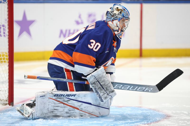 Nov 23, 2024; Elmont, New York, USA;  New York Islanders goaltender Ilya Sorokin (30) gets ready for the start of the third period against the St. Louis Blues at UBS Arena. Mandatory Credit: Wendell Cruz-Imagn Images