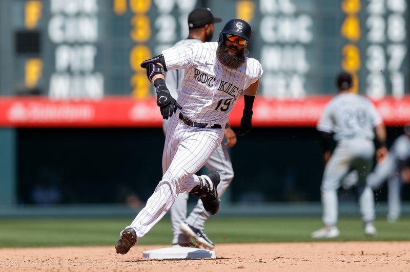 Aug 20, 2023; Denver, Colorado, USA; Colorado Rockies designated hitter Charlie Blackmon (19) rounds second on a triple in the fifth inning against the Chicago White Sox at Coors Field. Mandatory Credit: Isaiah J. Downing-USA TODAY Sports