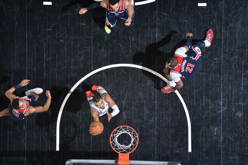 SAN ANTONIO, TX - JANUARY 29: Tre Jones #33 of the San Antonio Spurs drives to the basket during the game  against the Washington Wizards  on January 29, 2024 at the Frost Bank Center in San Antonio, Texas. NOTE TO USER: User expressly acknowledges and agrees that, by downloading and or using this photograph, user is consenting to the terms and conditions of the Getty Images License Agreement. Mandatory Copyright Notice: Copyright 2024 NBAE (Photos by Michael Gonzales/NBAE via Getty Images)