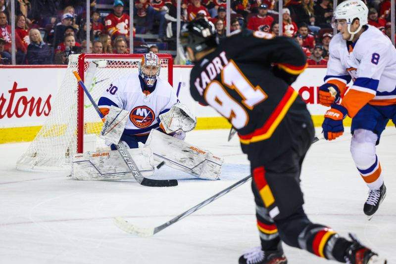 Nov 18, 2023; Calgary, Alberta, CAN; New York Islanders goaltender Ilya Sorokin (30) makes a save against Calgary Flames center Nazem Kadri (91) during the overtime period at Scotiabank Saddledome. Mandatory Credit: Sergei Belski-USA TODAY Sports