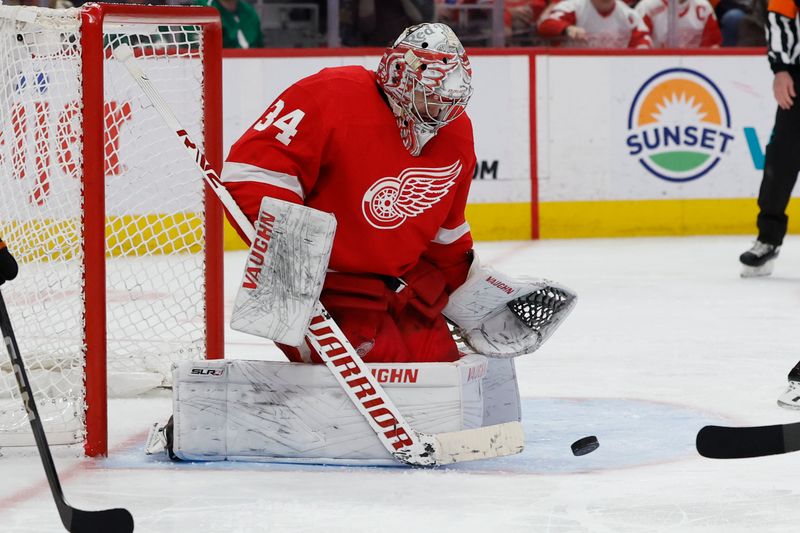 Jan 25, 2024; Detroit, Michigan, USA;  Detroit Red Wings goaltender Alex Lyon (34) makes a save in the third period against the Philadelphia Flyers at Little Caesars Arena. Mandatory Credit: Rick Osentoski-USA TODAY Sports