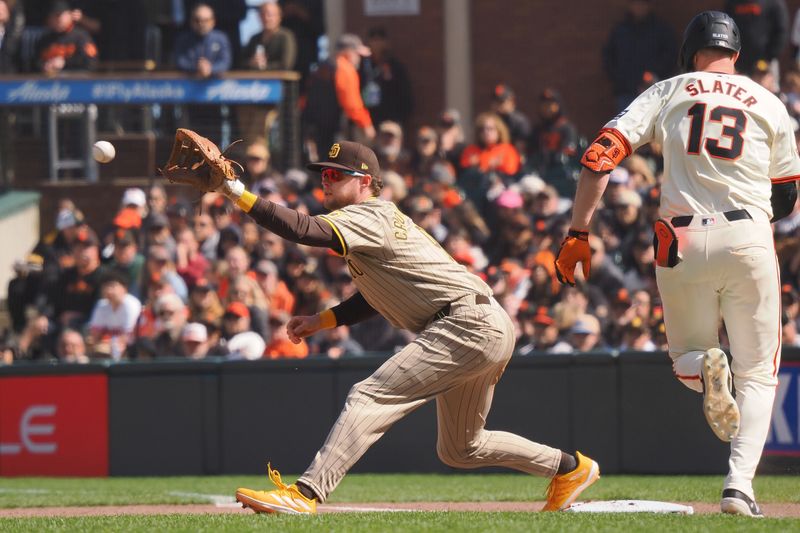 Apr 5, 2024; San Francisco, California, USA; San Diego Padres first baseman Jake Cronenworth (9) forces out San Francisco Giants center fielder Austin Slater (13) at first base during the seventh inning at Oracle Park. Mandatory Credit: Kelley L Cox-USA TODAY Sports